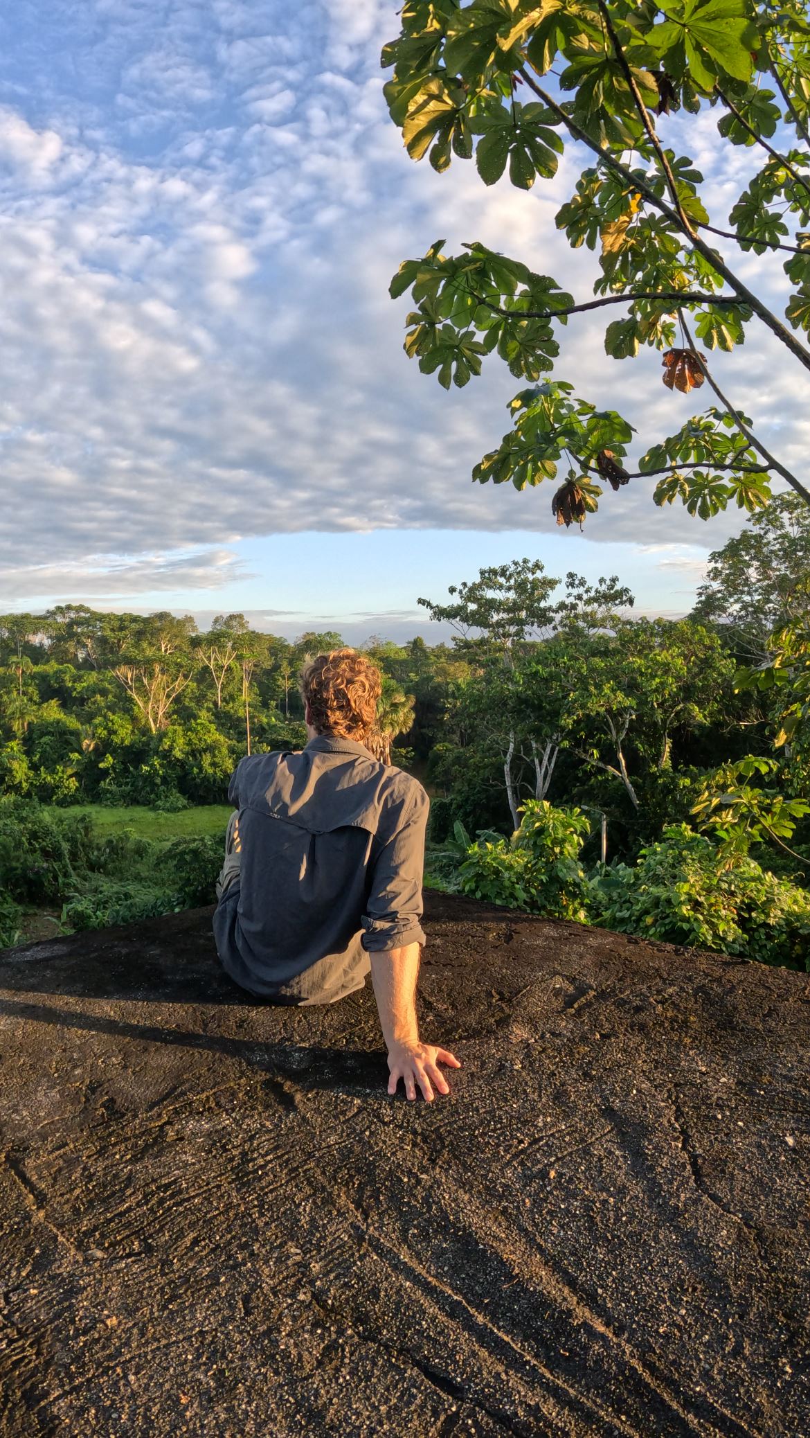Joe watching sunrise over the Amazon rainforest